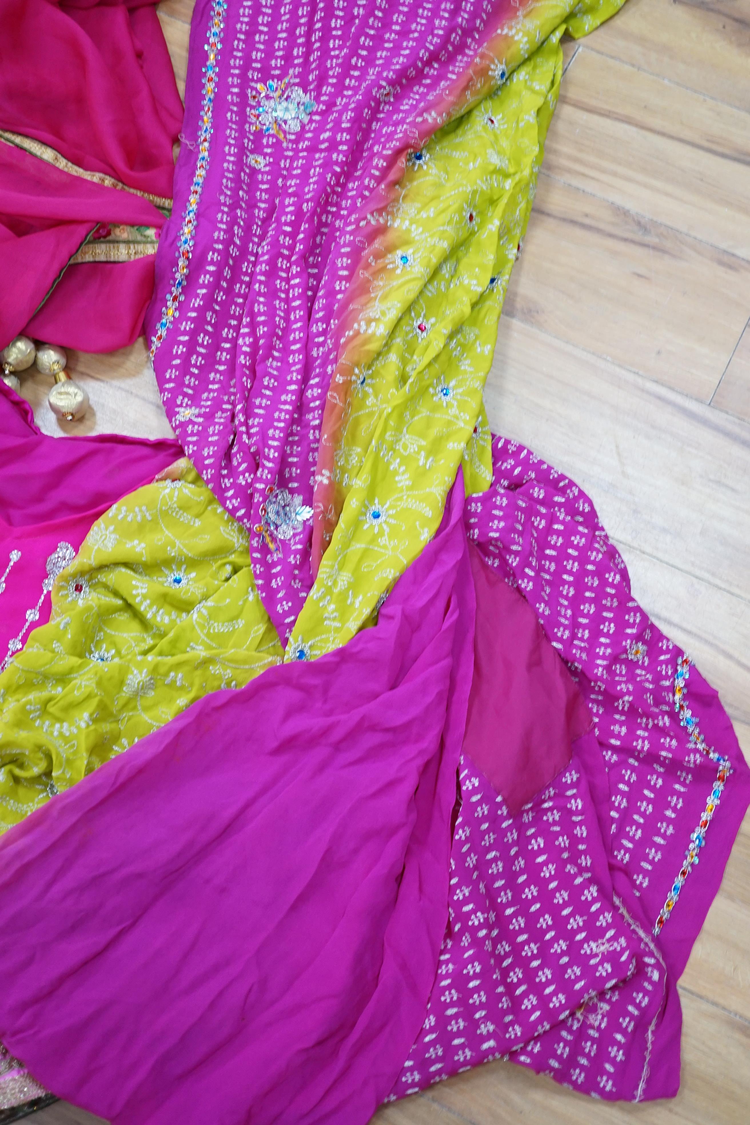 A collection of Indian silk saris and costume possibly bridal